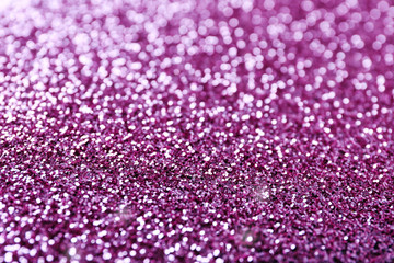 Texture of rose gold glitter as background, closeup