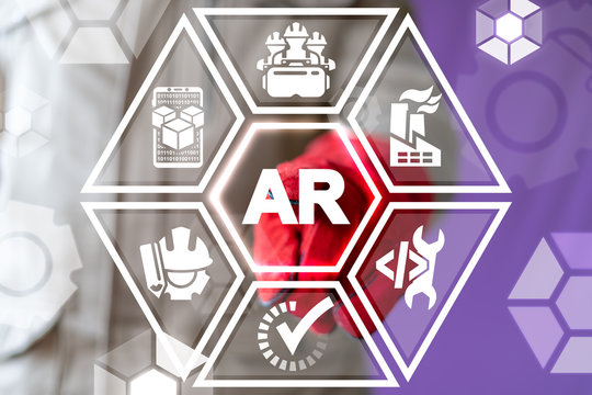 AR augmented virtual reality development industry production design concept. Worker or engineer working on a virtual screen of the future and touches the acronym: AR. VR Engineering construction.