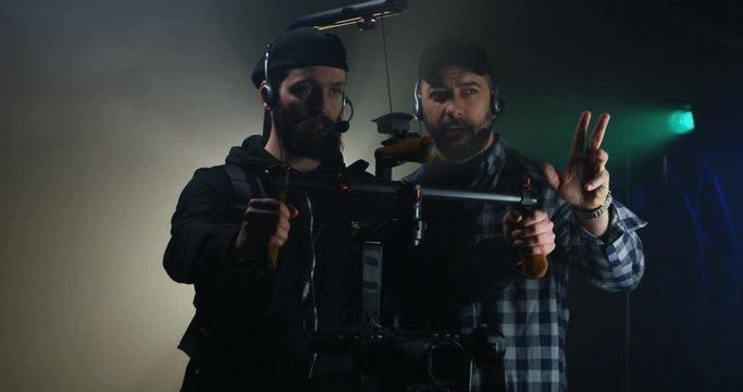 Director instructing a cameraman on a film set