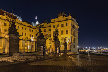 Fototapeta na wymiar Main Gate of Prague Castle with Statue of Battling Titans, Hradcanske Square at night, Prague, Czech Republic