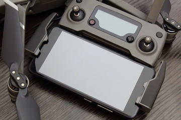 Remote control drone with smartphone.A fragment of the top view.