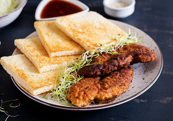 Ingredients for Katsu Sando - food trend japanese sandwich with breaded pork chop, cabbage and tonkatsu sauce. Japanese cuisine.