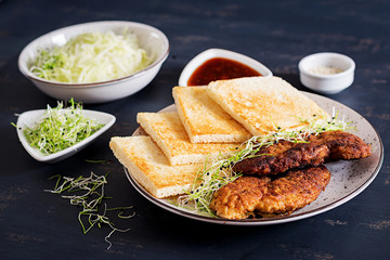 Ingredients for Katsu Sando - food trend japanese sandwich with breaded pork chop, cabbage and tonkatsu sauce. Japanese cuisine.