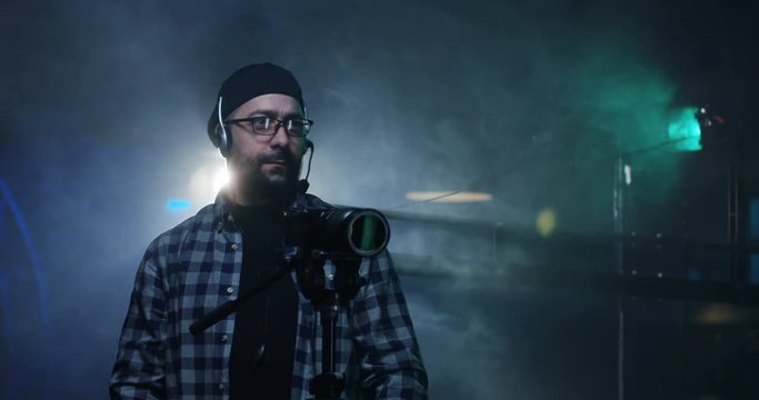 Young director giving instructions on a film set