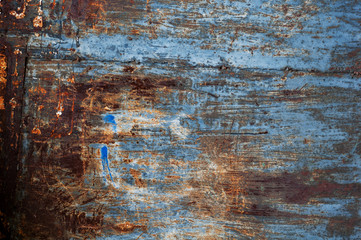 Horizontal background of old rusty burnt iron with peeling paint