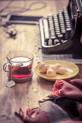 Workplace old school writer with tea and typewriter