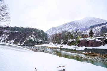 Fototapeta premium Villages of Shirakawago and Gokayama are one of Japan's UNESCO World Heritage Sites. Farm house in the village and mountain behind.