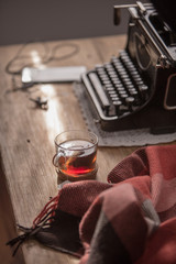 Workplace old school writer with tea and typewriter