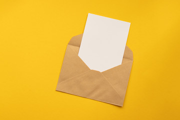 Blank white card with kraft brown paper envelope template mock up
