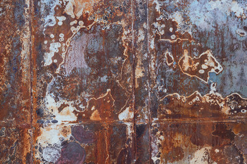 Horizontal background of old rusty burnt iron with a rough surface.