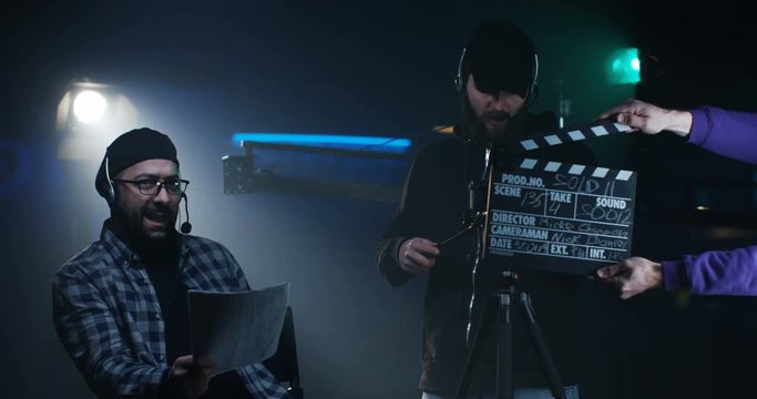 Young director giving instructions on a film set