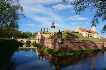 Obraz premium Nesvizh Castle on a sunny day. Nyasvizh, Nieśwież, Nesvizh,&nbsp;Niasvizh, Nesvyzhius, Nieświeżh, in Minsk Region, Belarus. Site of residential castle of the Radziwill family. 