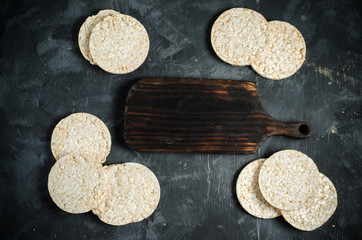 Rice cakes on black background with space for text