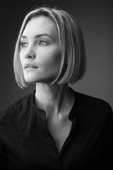 Dramatic black and white portrait of a beautiful woman on a dark background