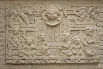 Beautiful white Java stucco patterned on the boundary wall. Vintage white wall bas-relief stucco in plaster, depicts Lotus flowers background.