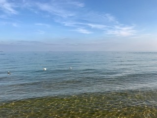 blue sky above the sea with clouds and sun in Greece