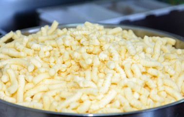 Soft cheese is cut on a special device. Cheese is used to prepare a variety of dishes, including pizza. Cheese is a milk concentrate.