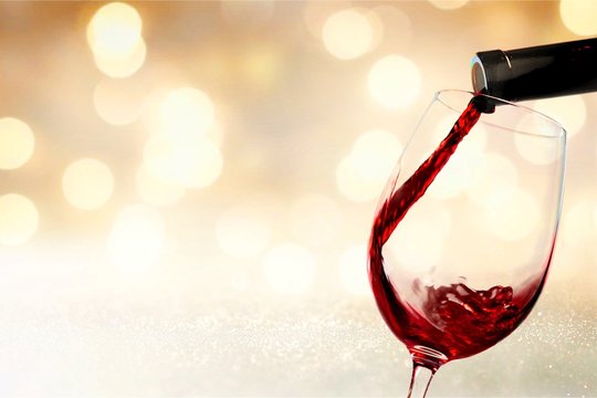 Red wine glass  on  background