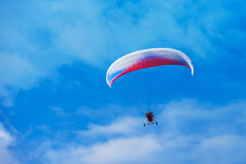 Paragliding in Altai mountains. Paragliders in fight in the mountains, concept of extreme sport activity.