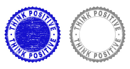 Grunge THINK POSITIVE stamp seals isolated on a white background. Rosette seals with grunge texture in blue and gray colors. Vector rubber stamp imprint of THINK POSITIVE label inside round rosette.