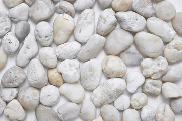 White pebbles stone texture background, View from above, closeup