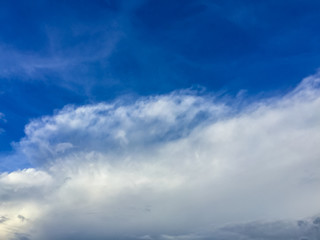 Fototapeta premium Sparse clouds in the blue sky morning background. Fluffy clouds in the blue sky evening background. Blue sky in summer background with tiny clouds,