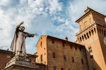 Monument to Girolamo Savonarola, famous monk and reformer, overlooking Castello Estense in Ferrara,...