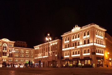 Piazza dell'Unita in Trieste with Palazzo del Municipio shot at night