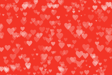 Heart shaped bokeh on red background. Valentine's day and love concept