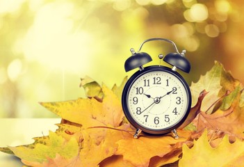 Retro alarm clock on table  background