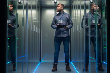 Adult IT engineers in server room