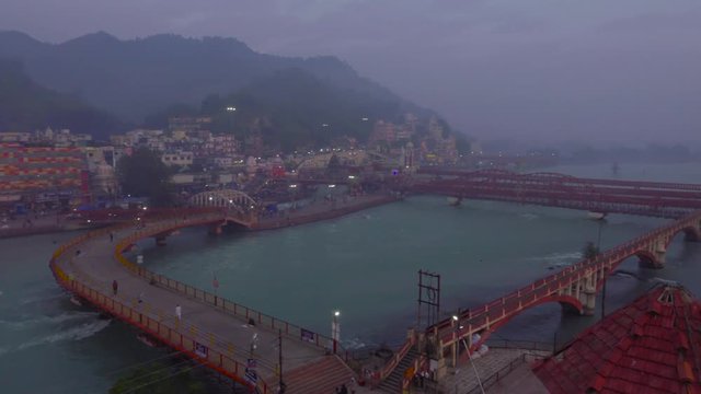 Right pan shot Haridwar, Uttarakhand, India.
Showing bridge, the holy river Ganges, Har ki Pauri, pilgrims. Haridwar or Hardwar is regarded as one of the seven holiest places to Hindus, India.