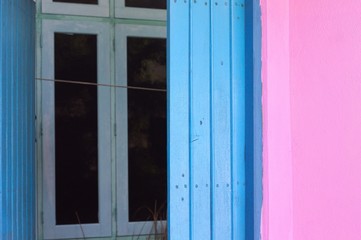 Blue window of a pink house (Ari Atoll, Maldives)
