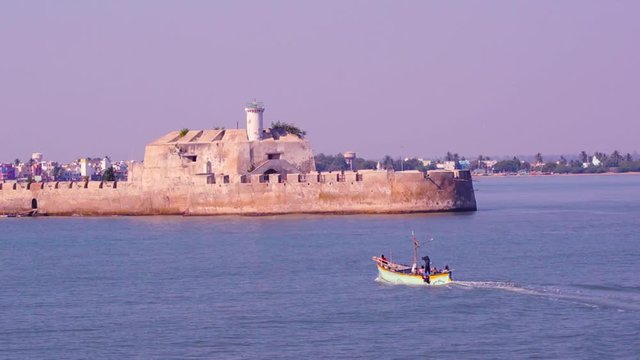 Zoom aerial shot of the Pani Kotha prison in the middle of the sea as seen from Diu fort Gujarat India