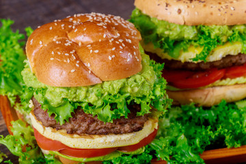 Delicious tasty grilled beef burger with guacamole