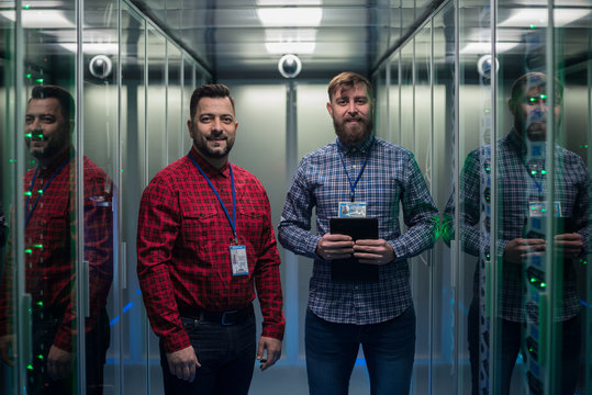 IT engineers using VR glasses in server room