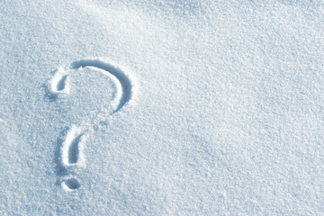 Question mark in the light blue bright snow. Leftside view