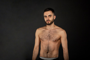 Fototapeta premium Half length portrait of sexy and expressive shirtless male