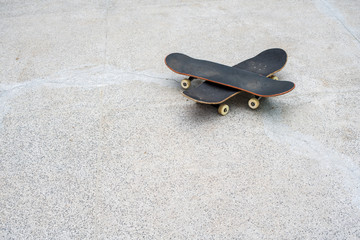 Crossed skateboards on a skate park