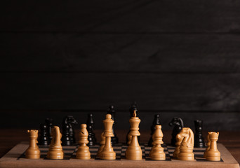 Chess board with chess pieces. Chess on the dark background. Business success concept. Strategy....