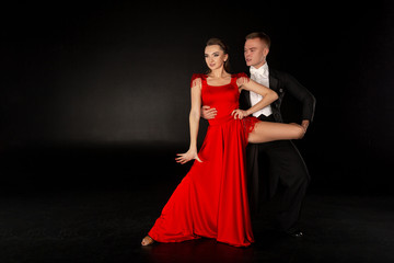 Pair of young dancers posing in dance pose