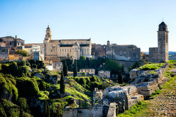 Gravina in Puglia: picturesque landscape of the the deep ravine and the old town with the ancient cathedral, Bari, Apulia, Italy