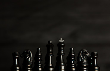 Chess board with chess pieces. Chess on the dark background. Business success concept. Strategy....