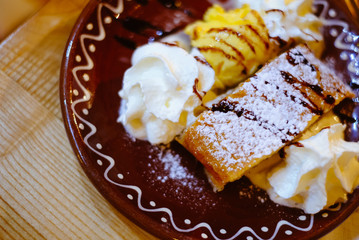 traditional Slovak pancakes with ice cream and whipped cream