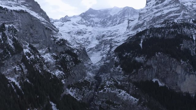 Aerial View, flight to Mittelhorn and Schreckhorn at the Upper Grindelwald Glacier in cloudy weather, Interlaken - Oberhasli, Canton of Bern, Switzerland