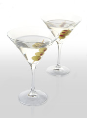 Two classic dry martini with olives on white background