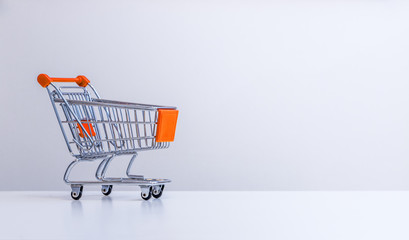 Sale: Shopping cart with copy space, grey