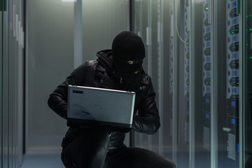 Anonymous hacker breaking into server system