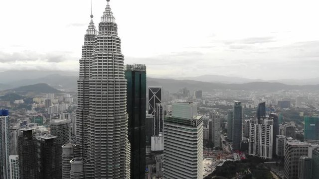 right aerial sweep of petronas towers