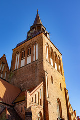 Fototapeta na wymiar Steeple of an old church in germany in front of blue cloudless sky
